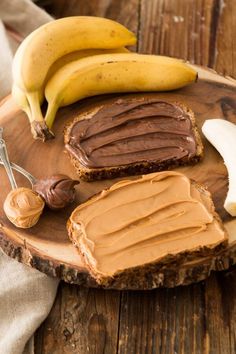 peanut butter and bananas on a wooden plate