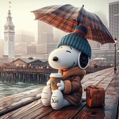 snoopy holding an umbrella while sitting on a dock next to the water with a cup of coffee