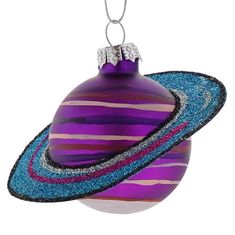 an ornament with a purple and blue striped ball hanging from it's side