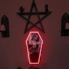 a red neon sign that reads killer on it's side next to other wall hangings