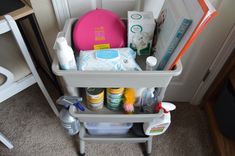 the baby changing table is filled with items