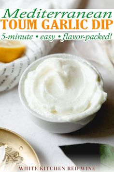 a bowl of cream sitting on top of a table