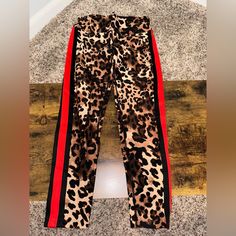 Calvin Klein Cheetah Leggings Color: Cheetah Print With Red Stripe Down The Side Size: Medium Never Worn Without Tags Cheetah Leggings, Red Stripe, Womens Calvin Klein, Cheetah Print, Colorful Leggings, Pant Jumpsuit, Calvin Klein, Pants For Women, Leggings