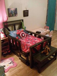 a child's bedroom with a bed, desk and chair