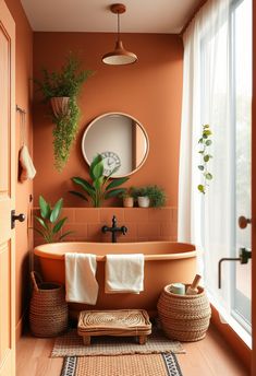 a bathroom with orange walls and wooden floors