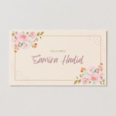 a business card with pink flowers and gold foil on the front, in pastel tones