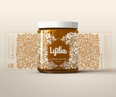 a jar of honey sitting on top of a table next to a label for lyfaia