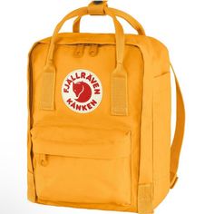 Fjall|Raven Everyday Outdoor Kanken Mini Backpack Bag Warm Yellow Nwt Features: Carry-On Size, Organizer Panel, Water-Resistant, Tablet Compatible Best Use: Work And School, Backpacking, Casual, Commuter Cycling, Travel Weight: 7.76 Oz Dimensions: 11.42 7.87 X 5.12 In. Frame Type: Frameless Pack Access: Top Pack Fabric: Vinylon-F Pack Pockets (+ Main Compartment): 4 Suspension / Stays: Foam Panel Pack Capacity: 7 Liters / 427 Cubic Inches Tags: Bright, Outdoor, School, Travel, Mini, Vacation, Ba Fjall Raven Kanken, Commuter Cycling, Yellow Backpack, Kanken Mini, Carry On Size, Foam Panels, Mini Backpack, Kanken Backpack, Fjallraven Kanken