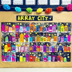 a bulletin board is decorated with colorful paper houses and flowers on the front, along with words that read array city