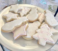 a plate full of decorated cookies on a table