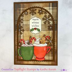 a christmas card with two mugs filled with hot chocolate