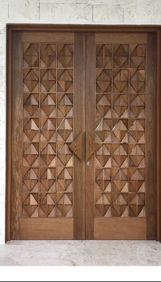 two wooden doors with geometric designs on the front and side panels, both made out of wood