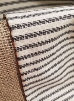 a close up of a piece of cloth on a chair with burlap material