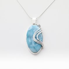 "Wave after wave has brought us to this one-of-a-kind pendant, an accurate representation of the motion that brings our ocean. Mesmerize yourself with this handcrafted pendant Magaly made of 925 silver and blue Larimar stone. - Materials: Larimar stones and 925 Silver  - Weight: 23 grams - Dimensions: 49 mm long (including bail) x 22 mm wide x 11 mm thick - Open back. 📌 Optional silver chain length: 18 Inches long 📣 ONLY 1 AVAILABLE. YOU WILL RECEIVE THE SAME PIECE FEATURED IN THESE PICTURES. Oval Blue Larimar Jewelry, Sculpting Inspiration, Jewelry Materials, Gold Heart Ring, Larimar Jewelry, Larimar Pendant, Larimar Stone, Silver Design, Leather Chokers