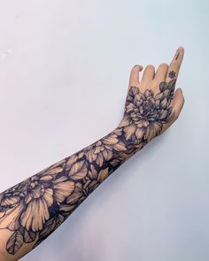 a person's arm with flowers on it