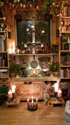 a room filled with lots of books and candles