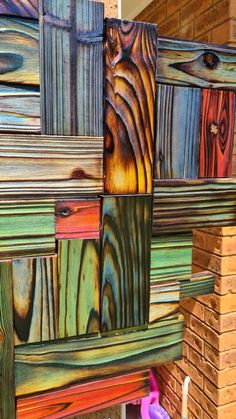 colorful wood panels are stacked on top of each other