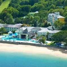 an aerial view of the resort and beach