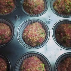 a muffin tin filled with lots of food