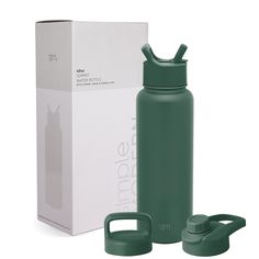 a green water bottle next to a white box with the lid open and handle extended