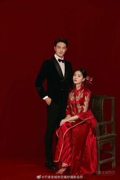 a man in a tuxedo standing next to a woman in a red dress