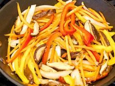 the food is being cooked in the pan on the stove top and ready to be eaten