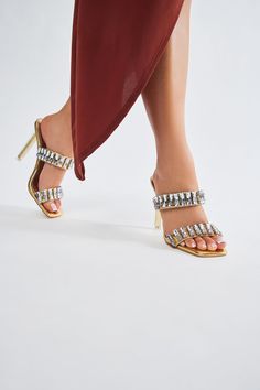 Available In Gold And Silver. Heeled Sandals Metallic Jewel Embellishment Square Toe Ultra High Heel Imported | Still The One Embellished Heeled Sandals in Gold size 6.5 by Fashion Nova Holiday Embellished Ankle Strap Heels, Summer Heels With Bling And Round Toe, Summer Bling Heels With Round Toe, Gold Embellished Synthetic Sandals, Gold Pointed Toe Sandals With Rhinestones, Glamorous Embellished Sandals With Open Heel, Gold Sandals With Rhinestones For Events, Gold Rhinestone Pointed Toe Sandals, Glamorous Embellished High Heel Sandals