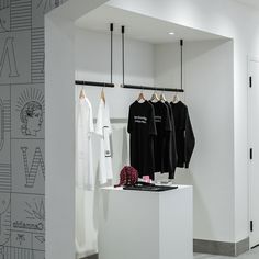 the clothing store is clean and ready for customers to use it's own racks