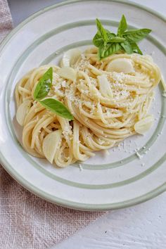 pasta with basil and parmesan cheese on a plate