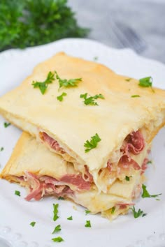 a close up of a plate of food with meat and cheese on it's crust