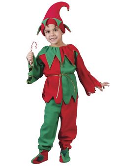 a young boy dressed in an elf costume