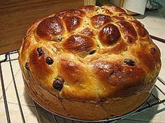 a baked bread sitting on top of a wire rack