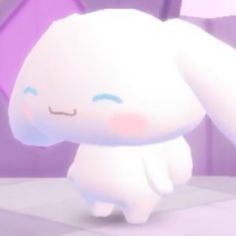 an animated white bunny sitting on top of a table next to a purple wall and floor