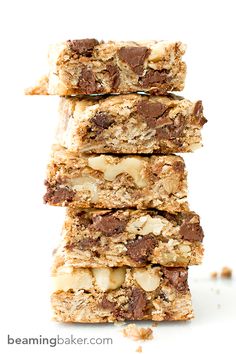 three bars stacked on top of each other with chocolate chips and nuts in the middle