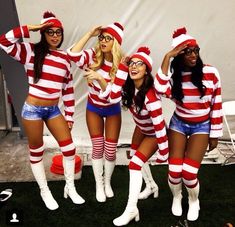 four women dressed in red and white striped outfits