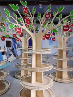 a group of wooden shelves with trees on them