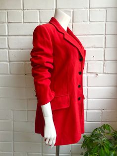 Vintage red music band blazer. Front upper pocket with embroidered music jazz symbolics. Very soft outter fabric, silky soft and colorful inlay. Front 4 button closure. Pockets: yes. Size: M-L Measurements (when laid flat): Length: 81 cm Sleeve: 61 cm Shoulders: 42 cm Chest: 48 cm Tag: iceberg Made in Italy. Shipping worldwide! Always with A+ priority and with tracking code. Order handling time 1-3 working days. Shipping via post 1-30 working days. If you have any questions - feel free to ask! Red Single-breasted Blazer For Winter, Red Single Breasted Blazer For Winter, Red Notch Lapel Blazer For Winter, Fitted Cotton Winter Blazer, Red Wool Long Sleeve Blazer, Retro Red Long Sleeve Blazer, Fitted Red Blazer For Winter, Retro Winter Blazer With Lapel Collar, Retro Cotton Blazer For Fall