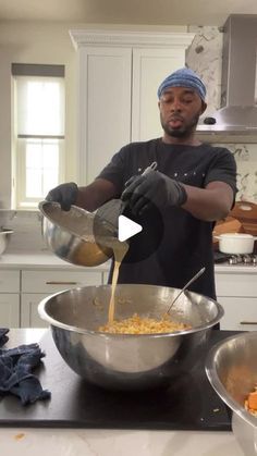 a man pouring something into a bowl on top of a counter