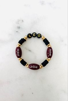 Customize with different sports, colors and your name! Volleyball Beaded Bracelets, Football Mom Bracelet, Football Hair Bows, Etsy Store Ideas, Football Hair, Team Bracelets, Football Bracelet, Stacked Bracelets, Braided Rope Bracelet