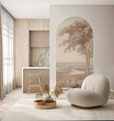 a white chair sitting in front of a painting on the wall