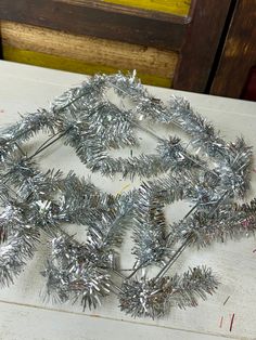 a bunch of tinsel on top of a table