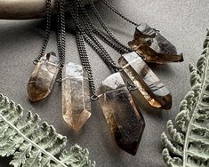 ✦ HOLIDAY SHOPPERS ✦ This item ships fast (within 1-2 business days), but may not arrive by Christmas. Many orders placed today will still arrive in time, but we can't guarantee it. We strongly recommend Priority or Express Mail to increase the chances of a swift delivery. Shop our collection of unique crystal jewelry here: https://chrysalism.etsy.com/ ♥ Thanks so much and Happy Holidays! ♥ Smoky Quartz Necklace: Carry a piece of the earth with you wherever you go with this stunning raw crystal Smoky Quartz Necklace, Quartz Crystal Pendant, Raw Crystal Necklace, Raw Crystal Jewelry, Goth Aesthetic, Steel Chain, Quartz Necklace, Crystal Points, Smoky Quartz