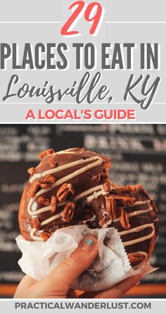 a person holding up a donut with chocolate drizzled on it and the words 29 places to eat in lonsville, ky