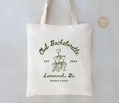 a tote bag hanging on a wall with the logo for cult bacardate