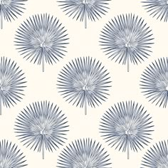 a blue and white wallpaper with large fan like shapes