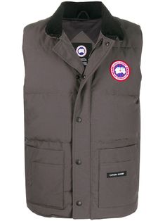 Recognised as the global-leader in high-quality outerwear, Toronto-based Canada Goose fashions timeless and stylish jackets that can withstand extreme weather conditions. Protection and performance are at the heart of the luxury fashion house. This Freestyle vest features a sleeveless design, a padded interior, a full lining, front pockets and a concealed front fastening. Canada Goose Fashion, Canada Goose Logo, Luxury Outerwear, Stylish Jackets, Jack Wolfskin, Extreme Weather, Fashion House, Canada Goose, Canada Goose Jackets