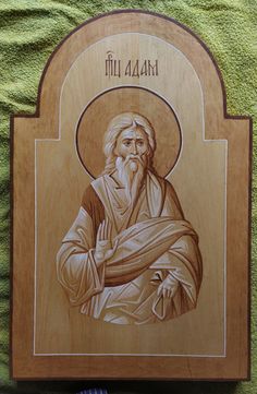 a wooden plaque with an image of jesus