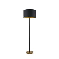 a black and gold floor lamp on a white background with the light turned off to show its dim lighting