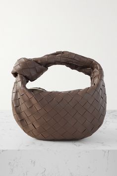 The signature intrecciato weave remains one of Bottega Veneta's most long-standing house codes - it's refined, elegant and instantly recognizable to those in the know. Made in Italy, this mini 'Jodie' tote is masterfully assembled from strips of supple leather and has a softly rounded shape. The top handle is artfully knotted at one side. Bottega Jodie, Bottega Veneta Bag Tote, Bottega Veneta Jodie Mini, Mini Jodie Bag, Bottega Veneta Jodie, Mini Jodie, Bottega Veneta Bag, Chelsea Boots Mens, Bag Obsession