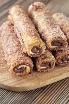 some type of pastry on a wooden plate